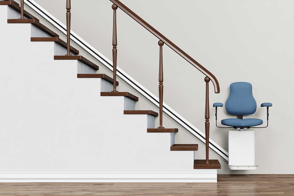 A wall-mounted stair climber for wheelchair users